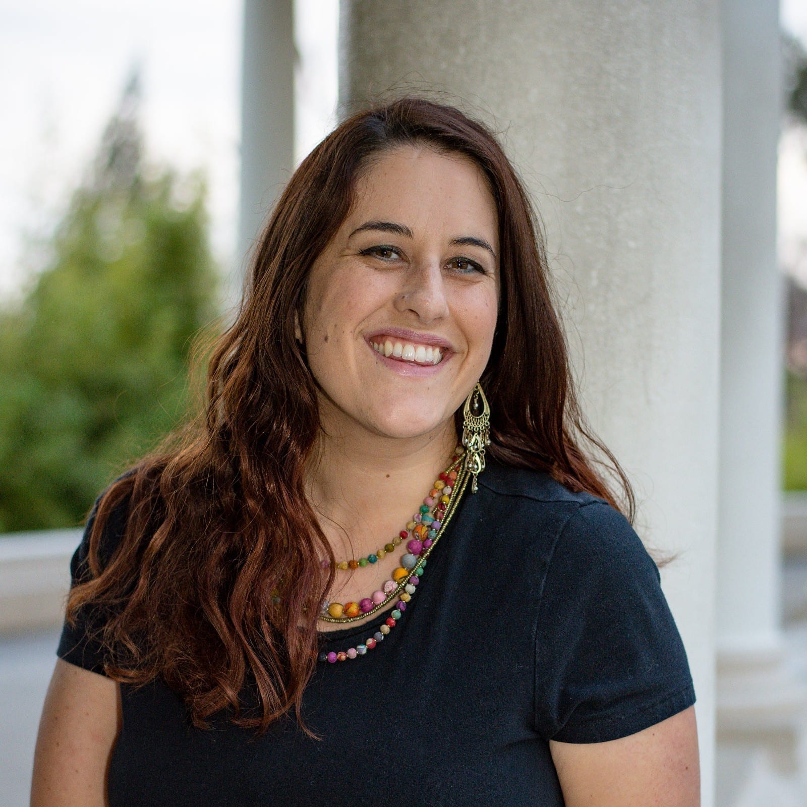Portrait of Elisa Johnston smiling outdoors